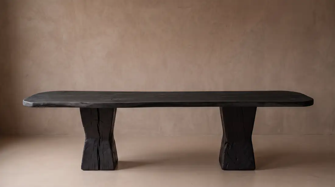 Black charred wood low table with waisted block legs